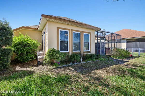a view of a backyard with a lake and trees