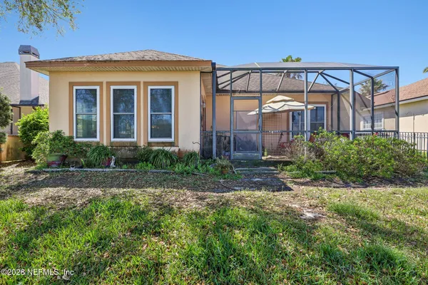 a view of a lake with houses in the background
