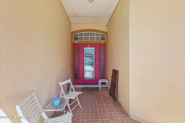 a view of an entryway with wooden floor