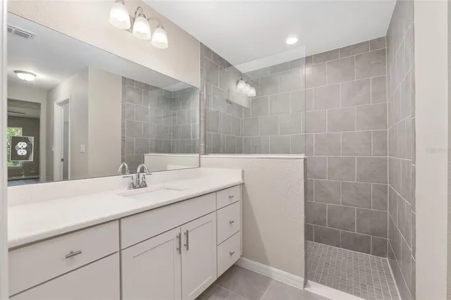 a bathroom with a double vanity sink and a mirror