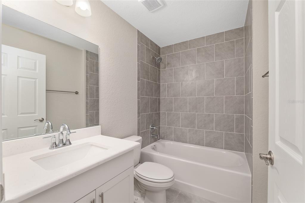 19230 Southwest 97th Street Dunnellon, FL 34432 - Photo 21 of 30 a bathroom with a sink a toilet and shower