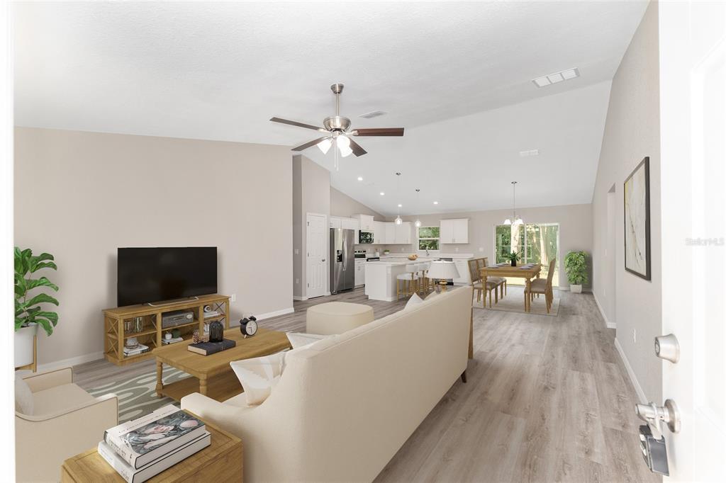 19230 Southwest 97th Street Dunnellon, FL 34432 - Photo 4 of 30 a living room with furniture and a flat screen tv