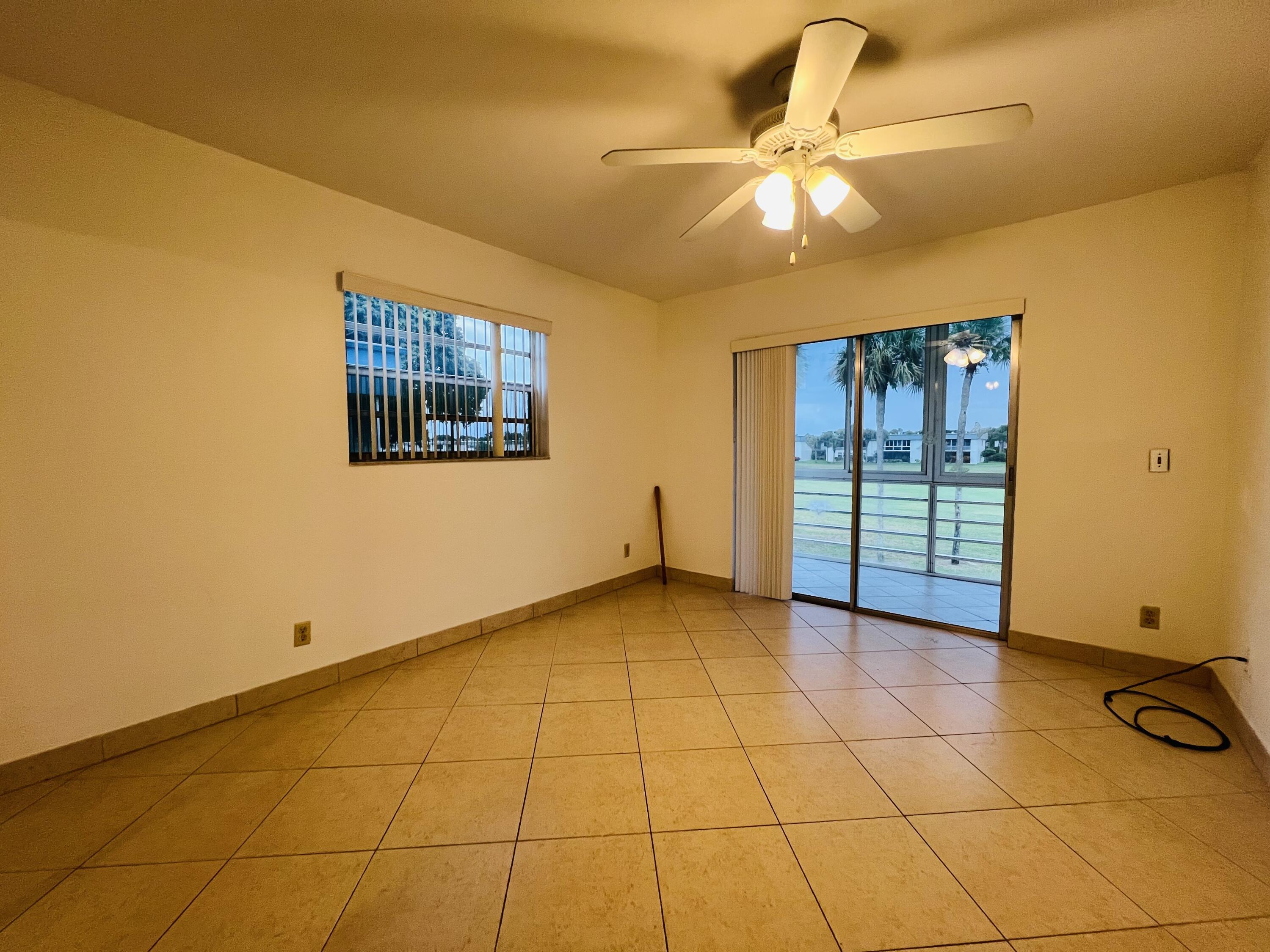 82 Normandy B Delray Beach, FL 33484 - Photo 11 of 31 a view of an empty room with a window