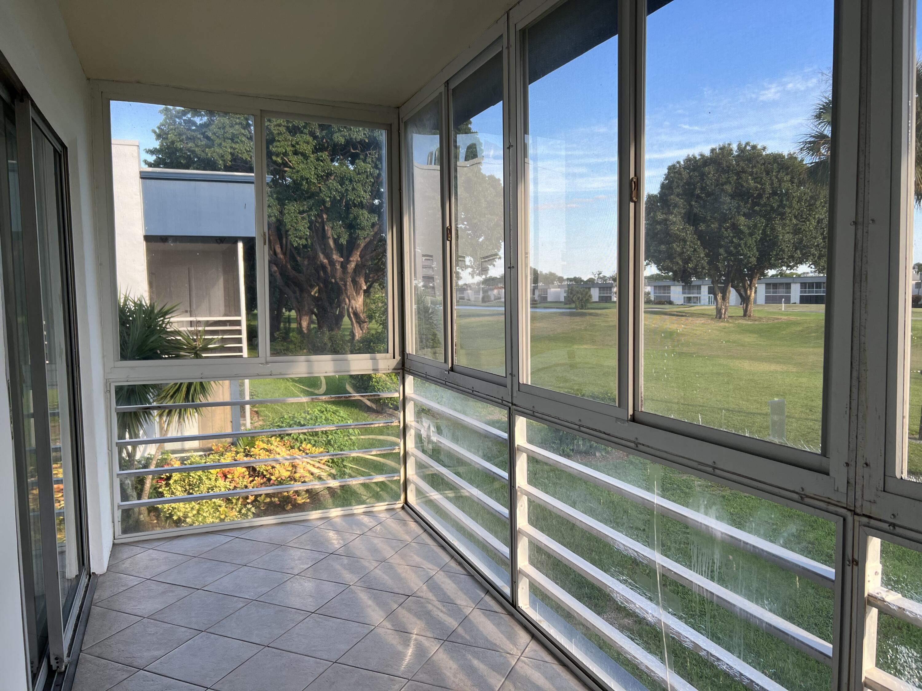 82 Normandy B Delray Beach, FL 33484 - Photo 25 of 31 a view of outdoor space with seating area