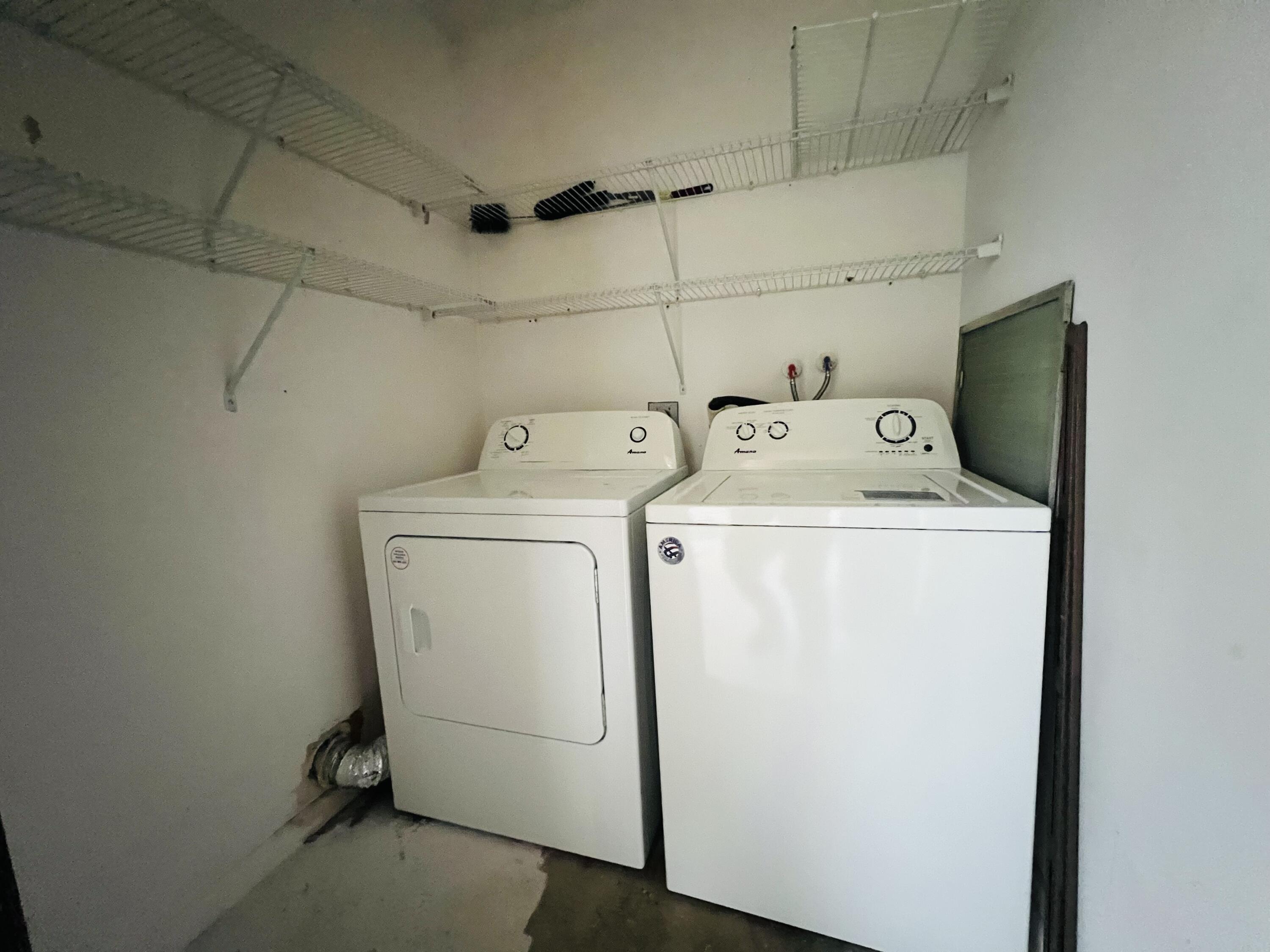 82 Normandy B Delray Beach, FL 33484 - Photo 26 of 31 a utility room with dryer and washer