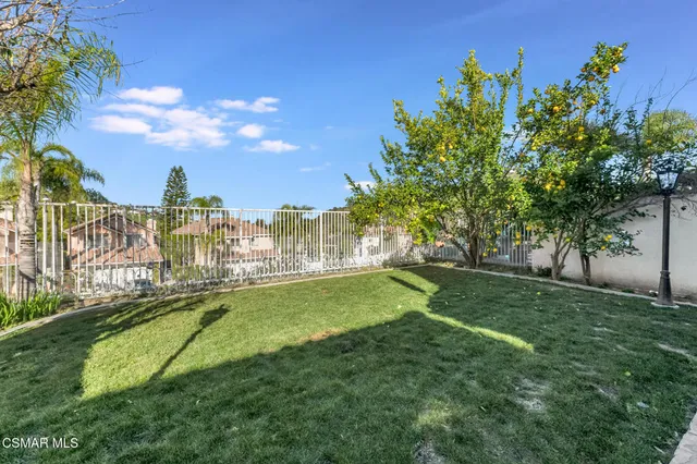 a view of a garden with a building in the background