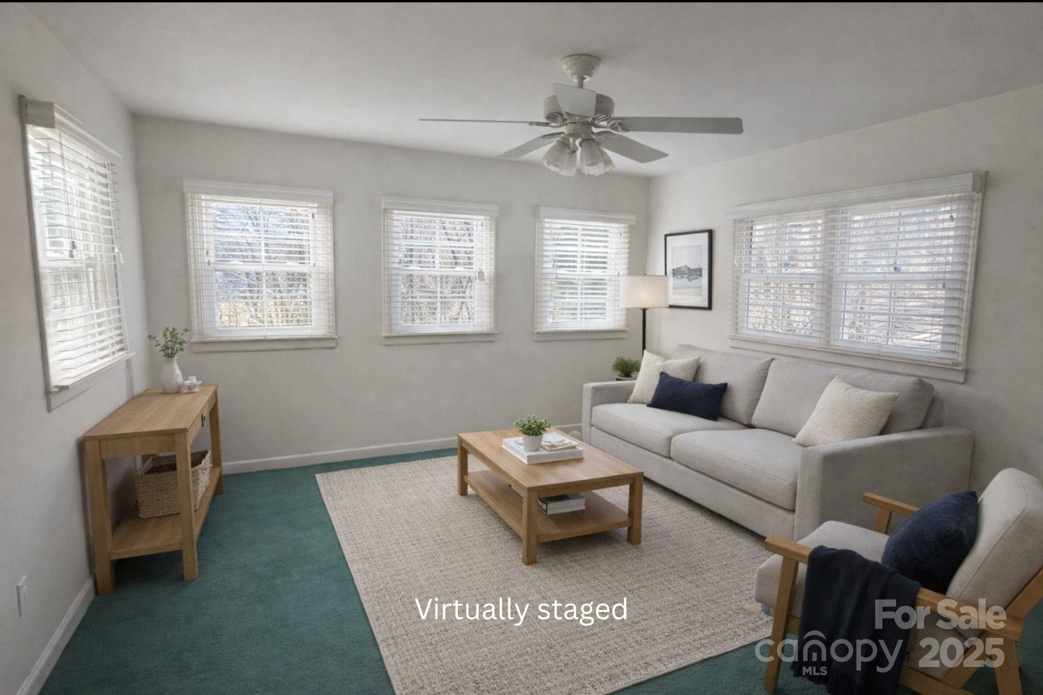 686 Elizabeth Street Southwest Concord, NC 28025 - Photo 20 of 44 a living room with furniture and a window