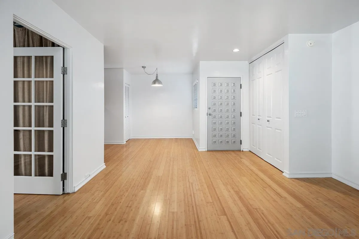 2600 Torrey Pines Road, Unit A31 La Jolla, CA 92037 - Photo 21 of 25 a view of empty room with wooden floor and cabinet