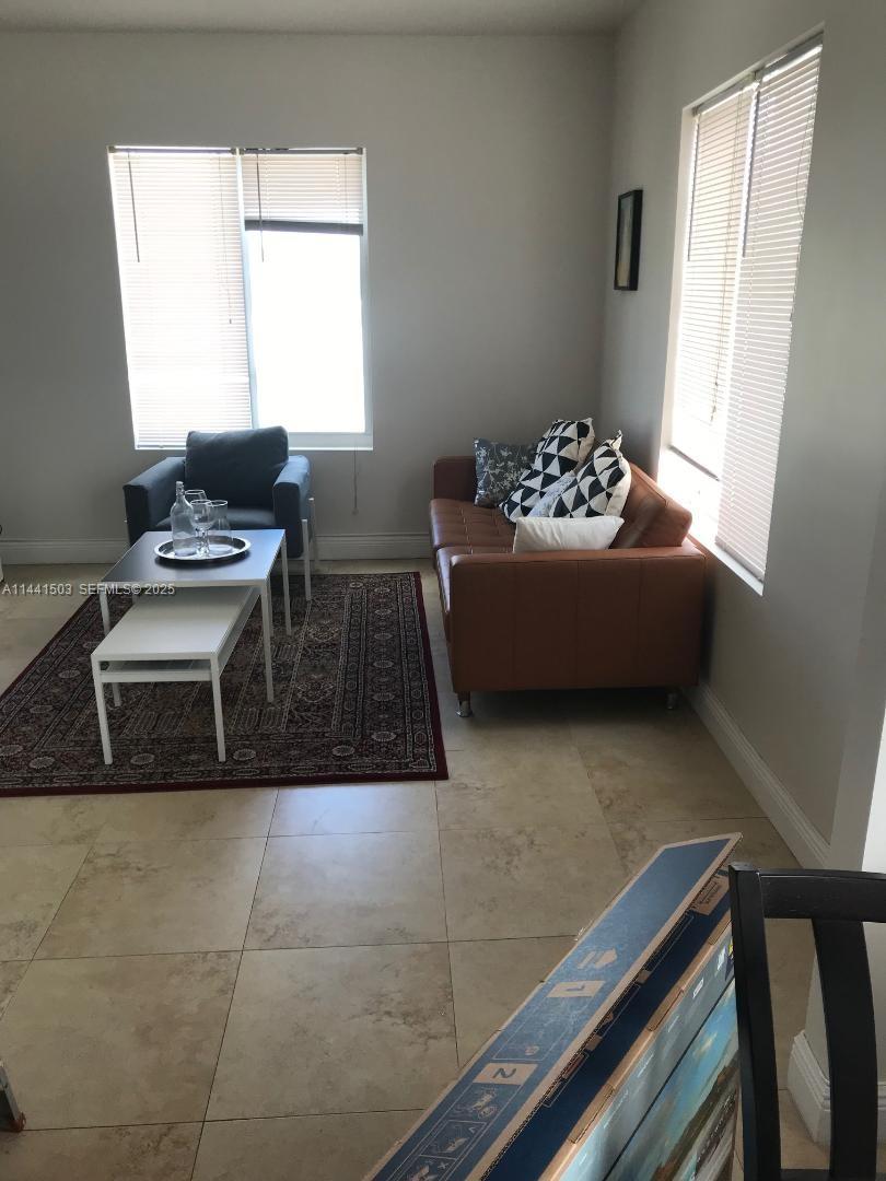 440 Southwest 5th Avenue Miami, FL 33130 - Photo 22 of 46 a living room with a couch and a window