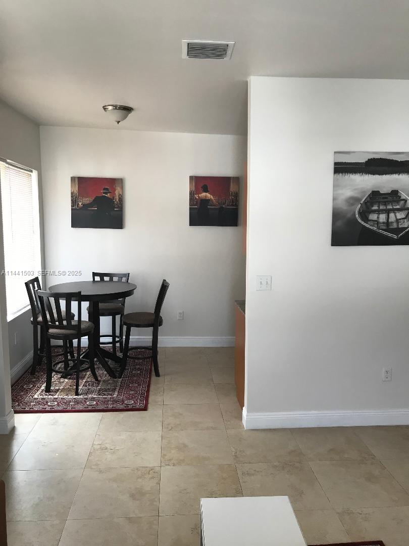 440 Southwest 5th Avenue Miami, FL 33130 - Photo 25 of 46 a view of a dining room with furniture