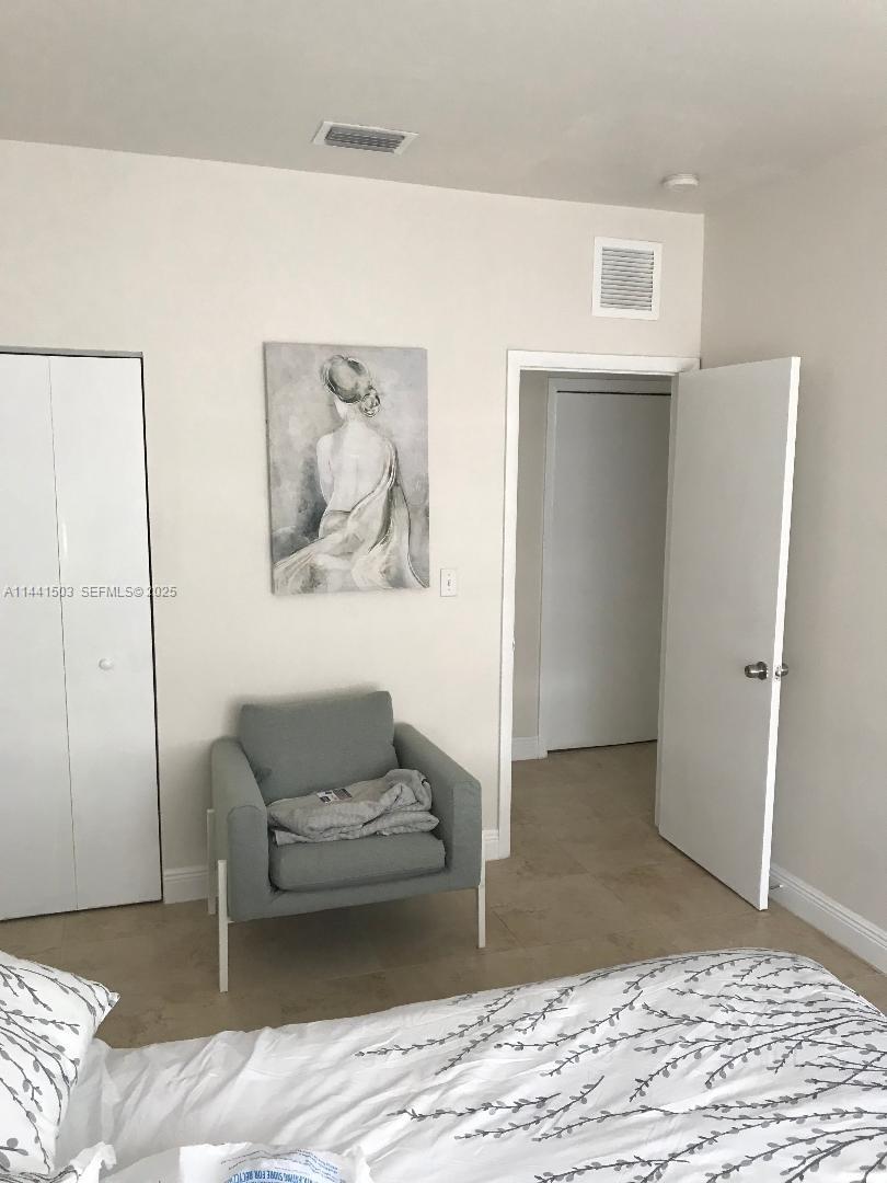 440 Southwest 5th Avenue Miami, FL 33130 - Photo 30 of 46 a living room with a couch and a view of kitchen