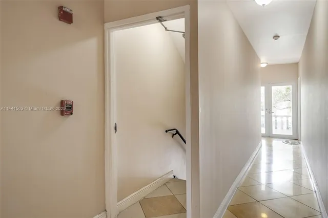 a view of a bathroom from a hallway