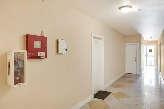 a view of a hallway with front door