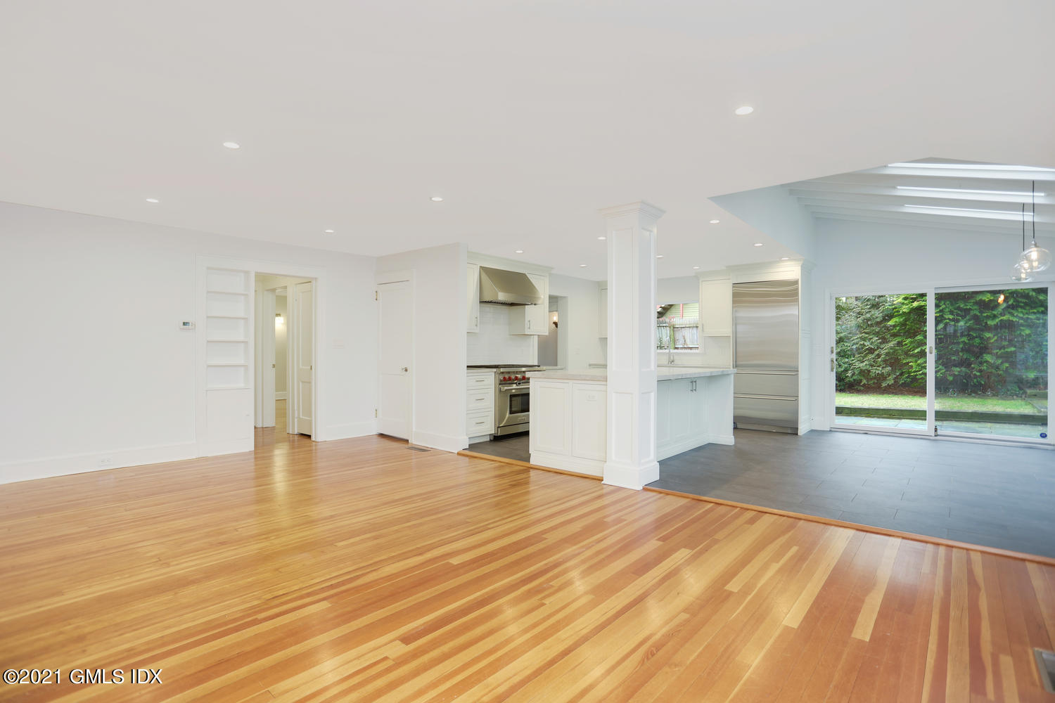 8 Potter Drive Old Greenwich, CT 06870 - Photo 2 of 11 a view of empty room with wooden floor and windows