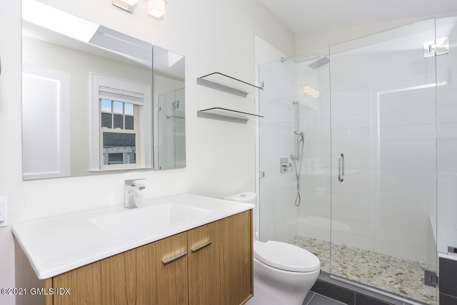 8 Potter Drive Old Greenwich, CT 06870 - Photo 6 of 11 a bathroom with a sink a toilet and shower