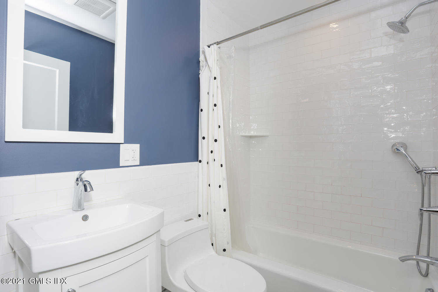 8 Potter Drive Old Greenwich, CT 06870 - Photo 7 of 11 a bathroom with a sink a toilet and shower