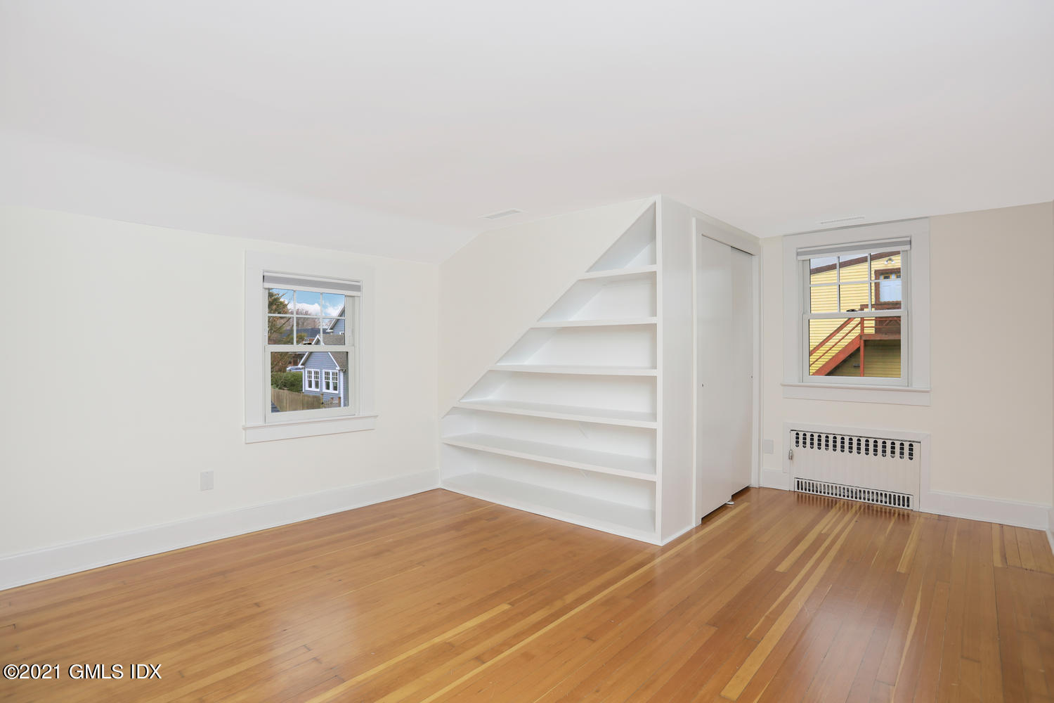 8 Potter Drive Old Greenwich, CT 06870 - Photo 8 of 11 a view of a bedroom with wooden floor and closet