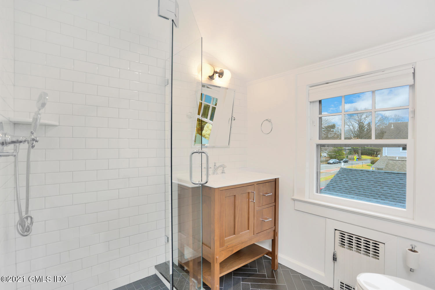 8 Potter Drive Old Greenwich, CT 06870 - Photo 10 of 11 a bathroom with a window and a shower