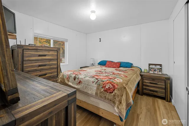 a bedroom with a bed and a dresser