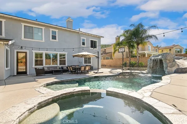 a view of a house with swimming pool