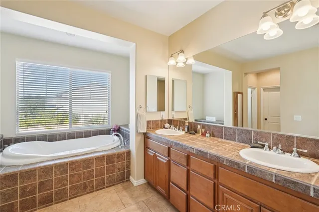 a bedroom with a bed chair and a window