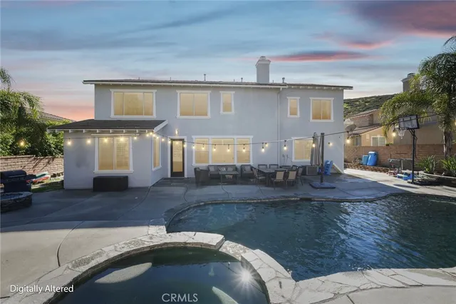a view of a house with pool and chairs