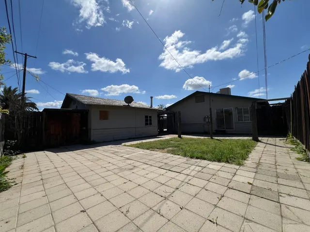 a house view with a garden space