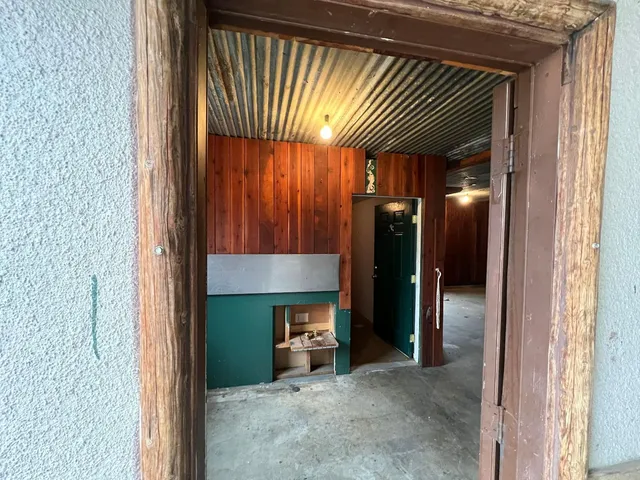 a view of a livingroom with furniture and staircase