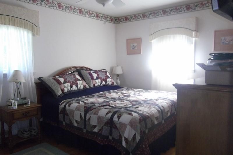 3728 Laurel Branch Road Northwest Floyd, VA 24091 - Photo 18 of 43 a bedroom with a bed and wooden floor