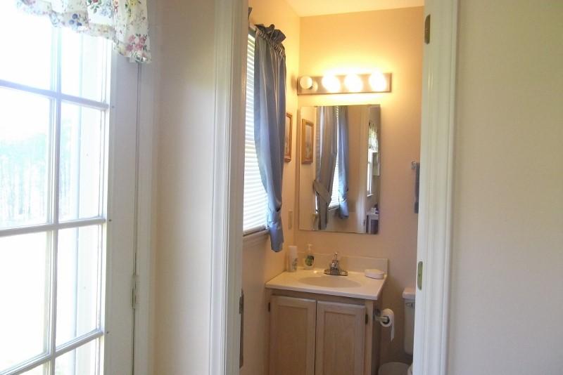 3728 Laurel Branch Road Northwest Floyd, VA 24091 - Photo 27 of 43 a bathroom with a sink a mirror and a window