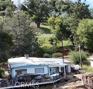 5643 Carleton Road Mariposa, CA 95338 - Photo 16 of 22 a view of a patio with table and chairs and potted plants
