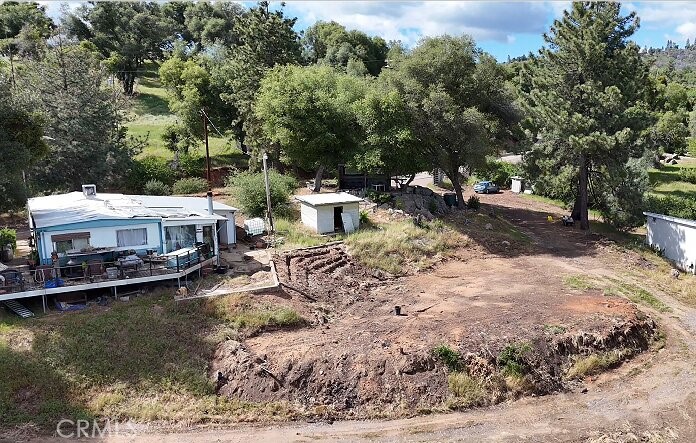 5643 Carleton Road Mariposa, CA 95338 - Photo 17 of 22 a view of a house with a yard and sitting area