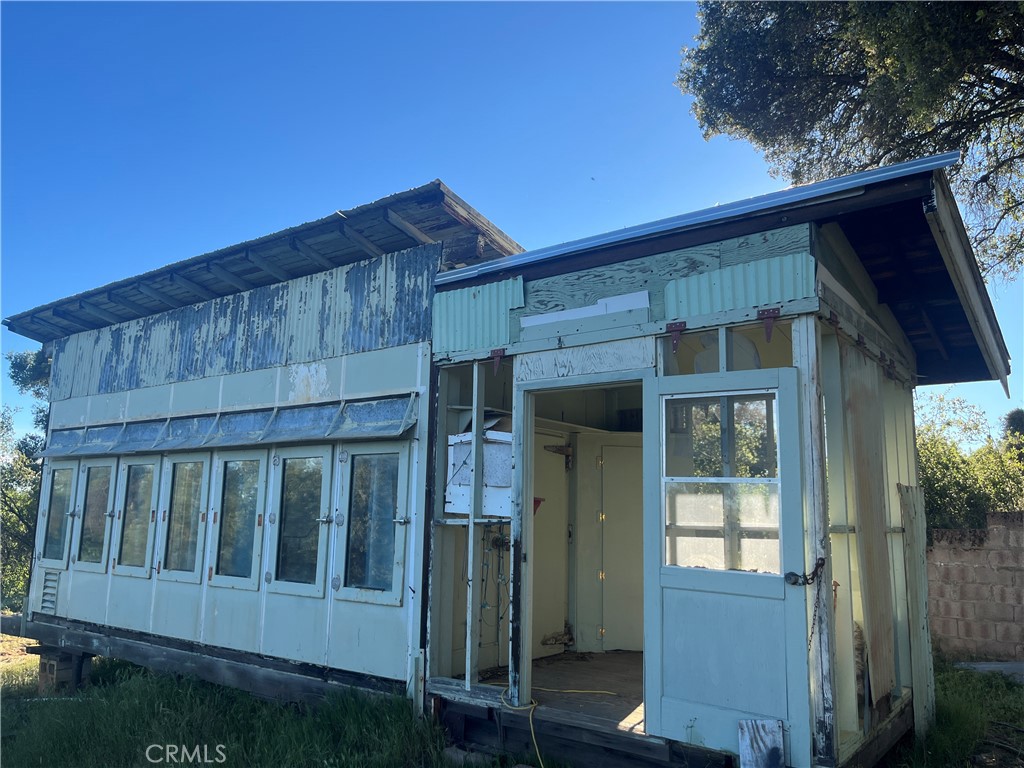 5643 Carleton Road Mariposa, CA 95338 - Photo 7 of 22 a view of wooden house with a small yard