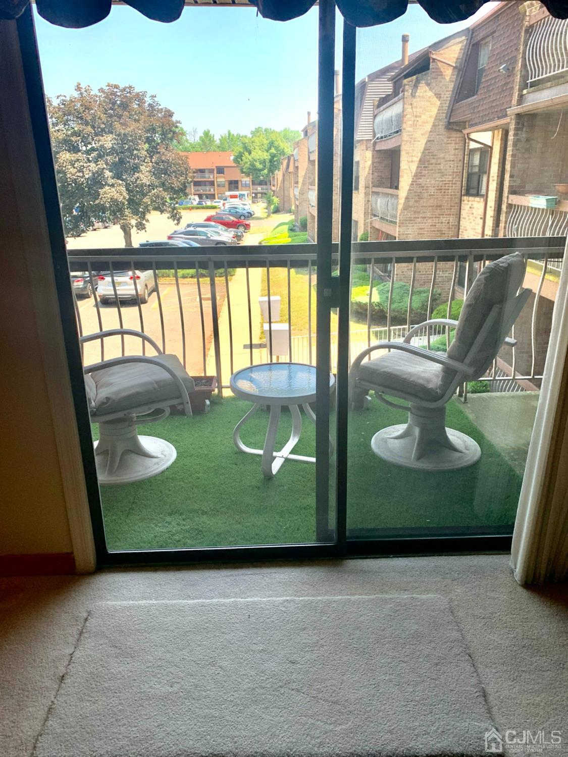 1517 Raspberry Court Edison, NJ 08817 - Photo 13 of 15 a view of a glass door with a chair