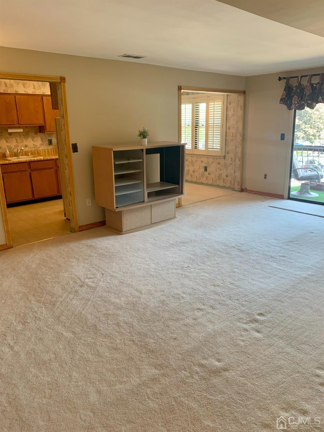 1517 Raspberry Court Edison, NJ 08817 - Photo 4 of 15 an empty room with windows and a fireplace