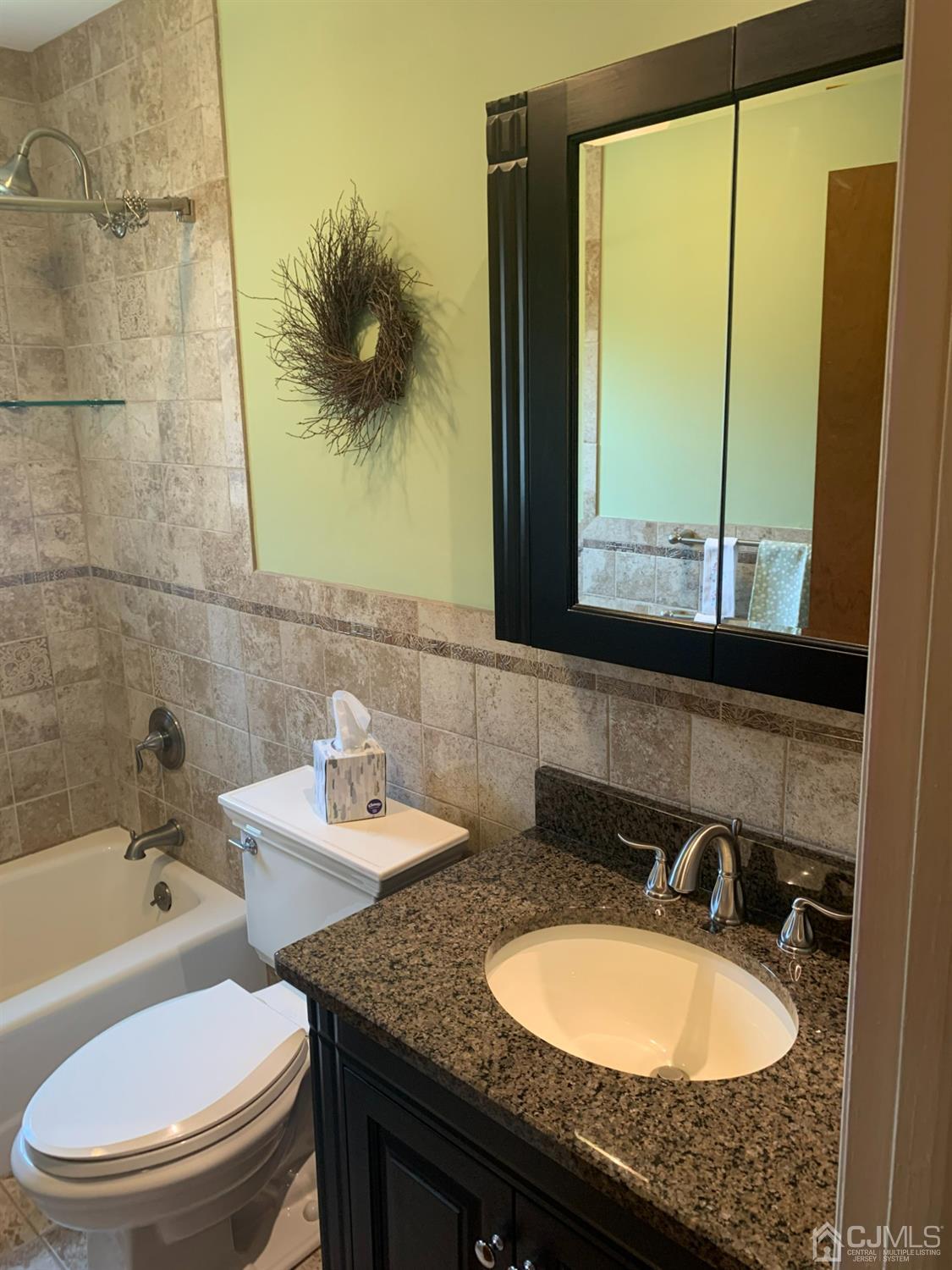 1517 Raspberry Court Edison, NJ 08817 - Photo 8 of 15 a bathroom with a granite countertop sink and a mirror
