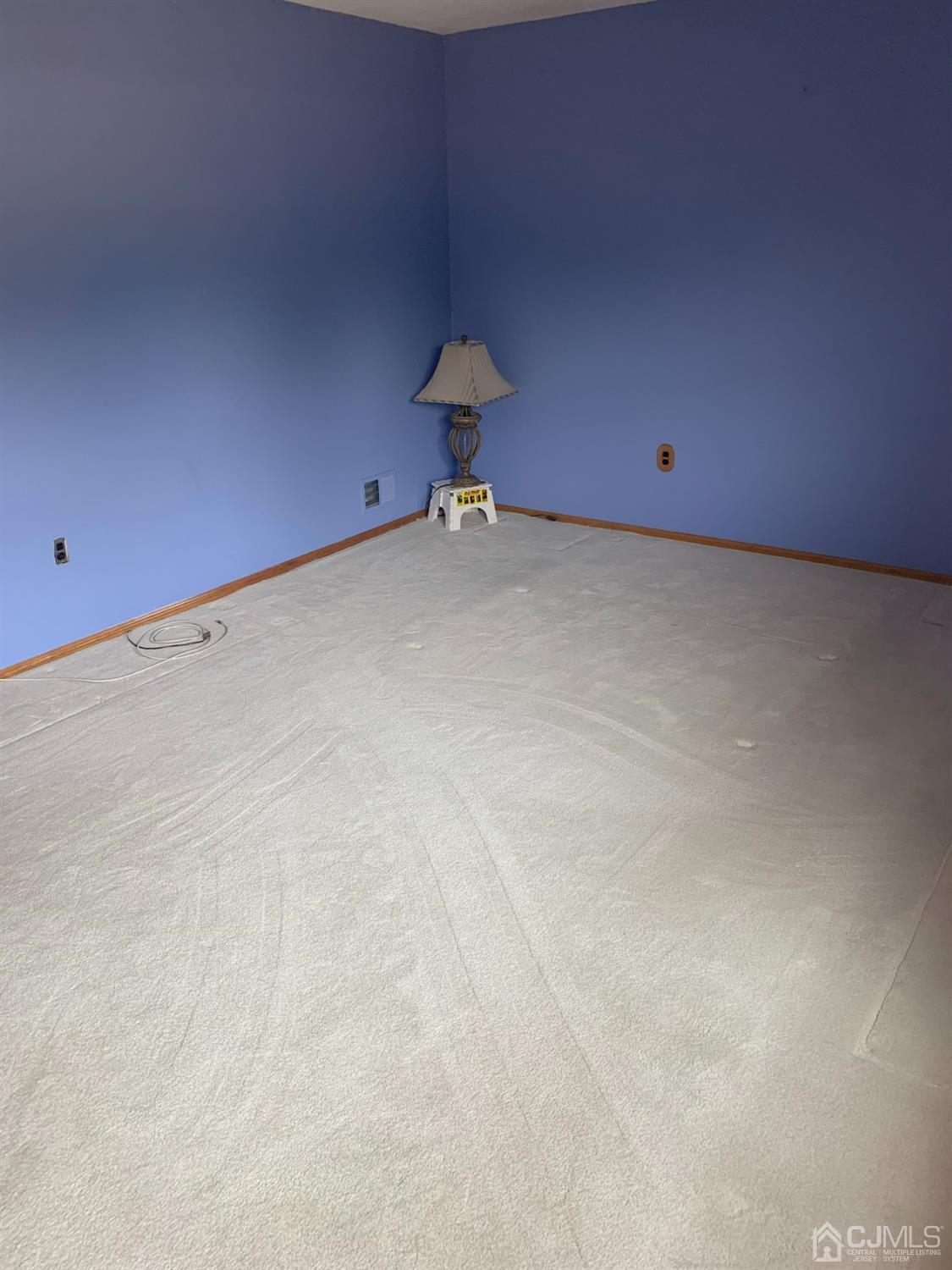 1517 Raspberry Court Edison, NJ 08817 - Photo 10 of 15 a view of a room with a table and a lamp