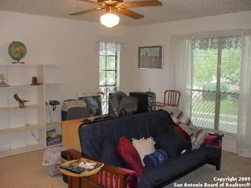a living room with furniture and a window