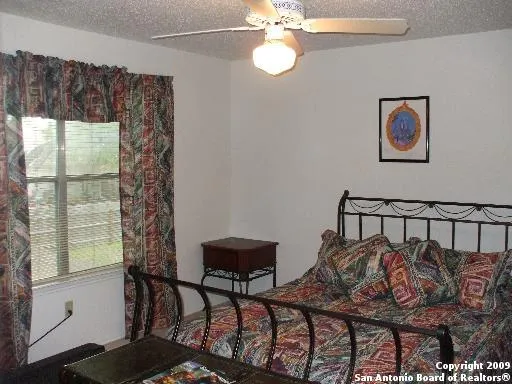 a view of a chairs and table in a balcony
