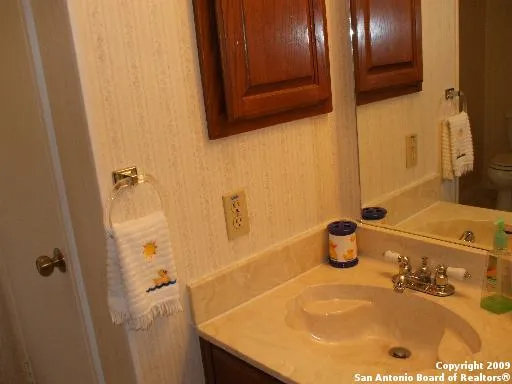 a bathroom with a tub and sink