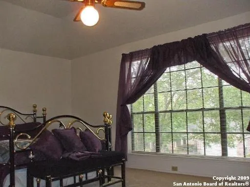 a view of a balcony dining table and chairs