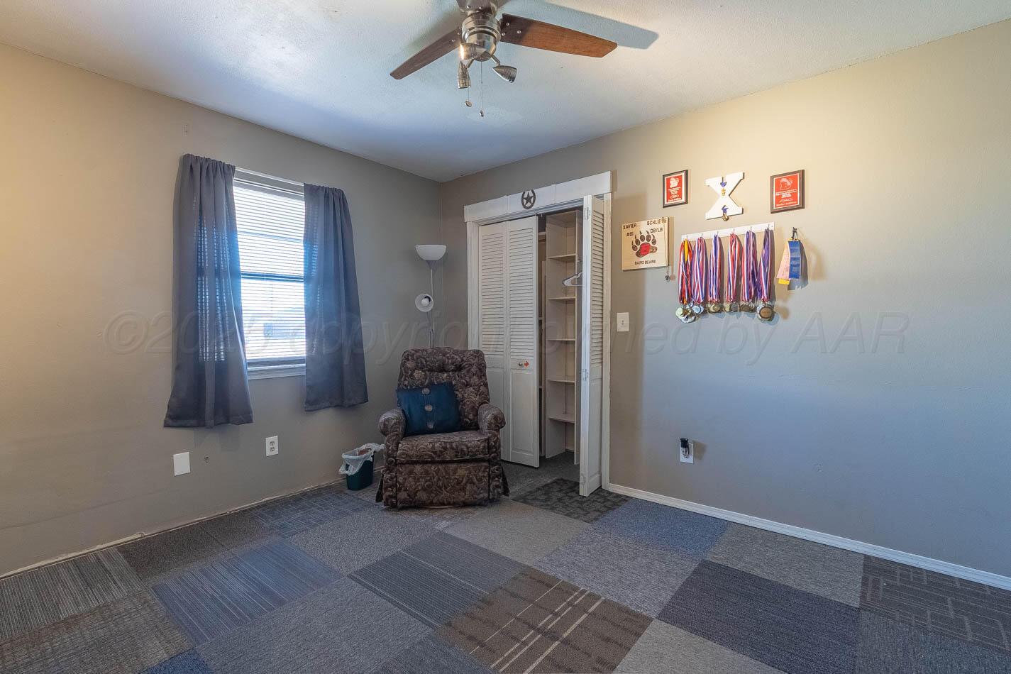 428 Overland Trail Fritch, TX 79036 - Photo 16 of 24 a living room with furniture and a window