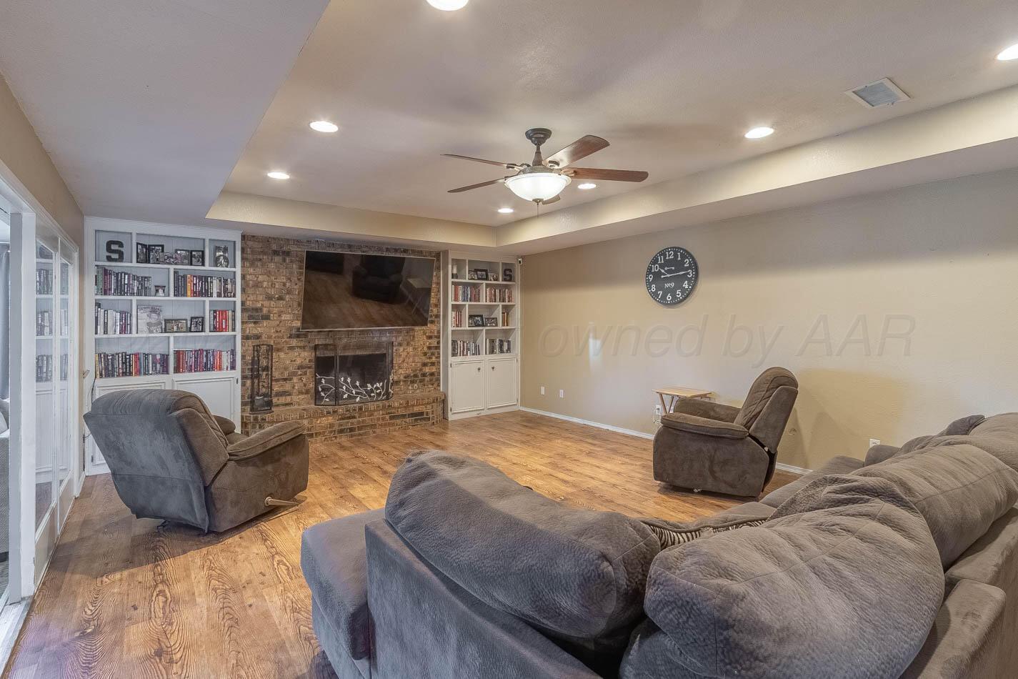 428 Overland Trail Fritch, TX 79036 - Photo 5 of 24 a bedroom with furniture and a fireplace