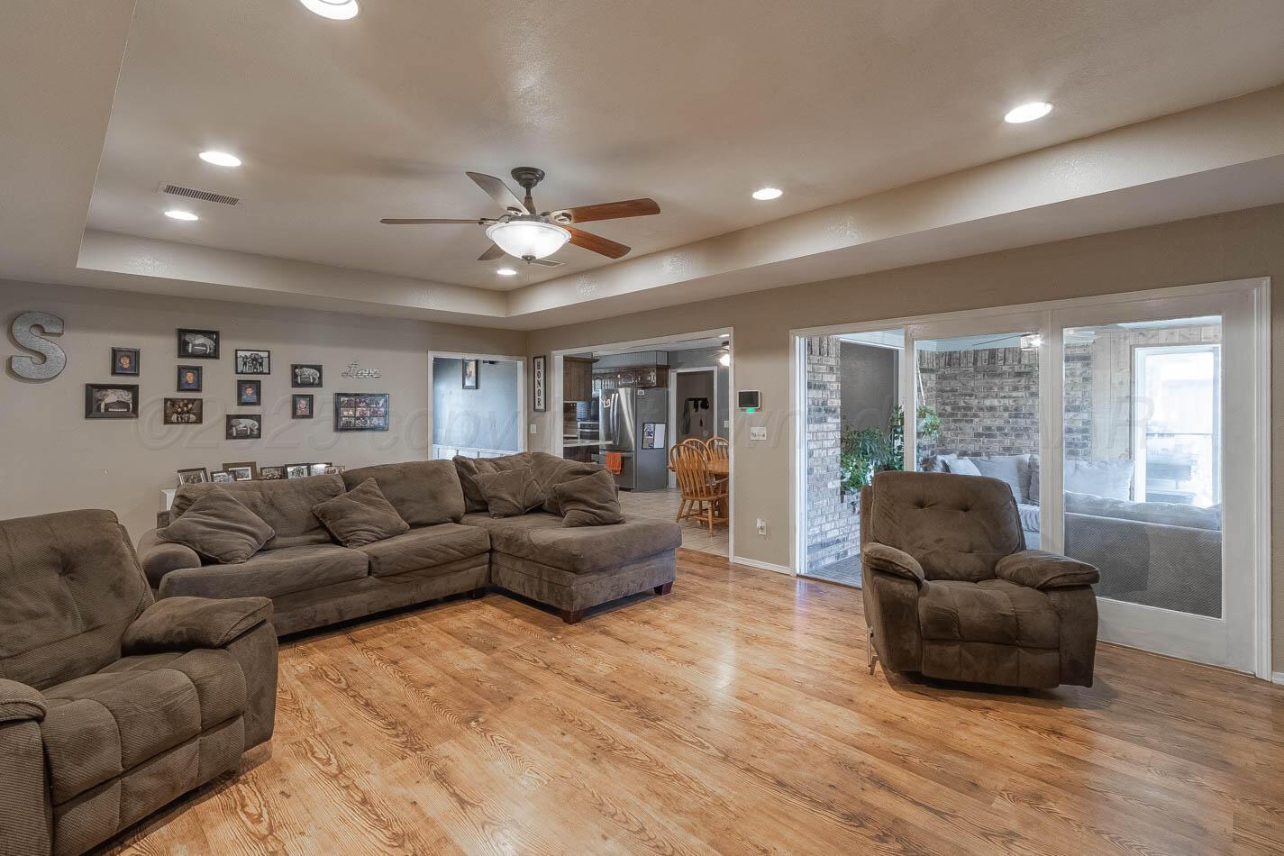 428 Overland Trail Fritch, TX 79036 - Photo 7 of 24 a living room with furniture and a flat screen tv