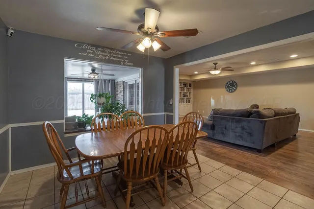 a dining room with furniture and window