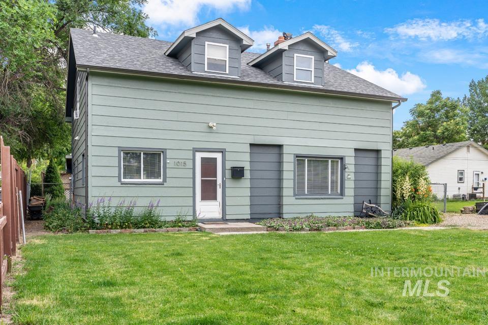 View of front of home featuring a shingled roof