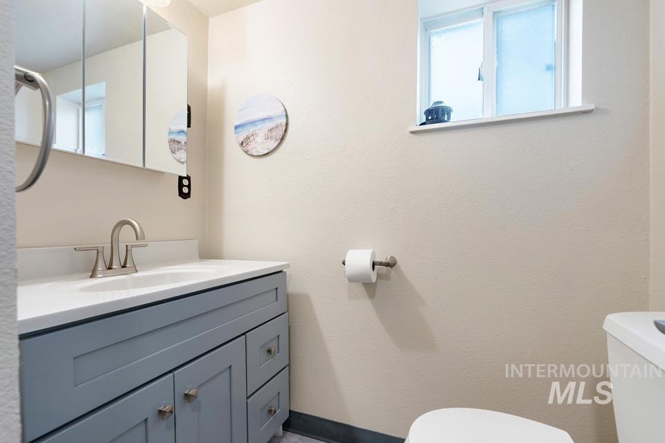 1015 East Park Street Weiser, ID 83672 - Photo 19 of 30 Half bath featuring toilet and vanity