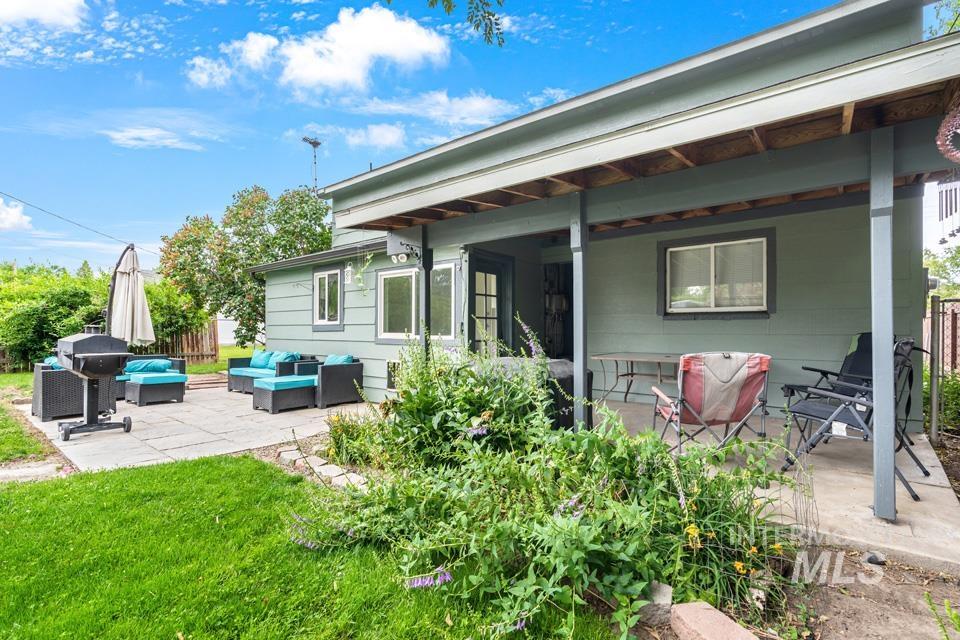 1015 East Park Street Weiser, ID 83672 - Photo 5 of 30 Back of house featuring a patio area and an outdoor living space