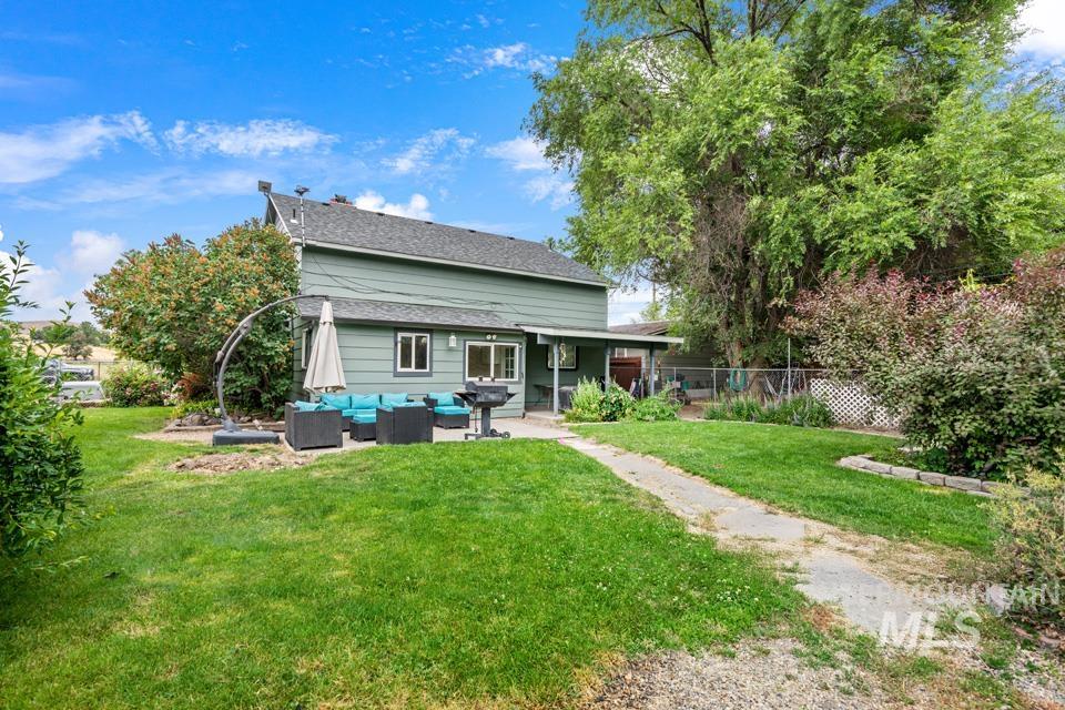 1015 East Park Street Weiser, ID 83672 - Photo 8 of 30 Rear view of house with a patio and an outdoor living space