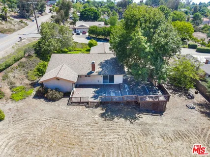 a view of a fire pit with flower plants